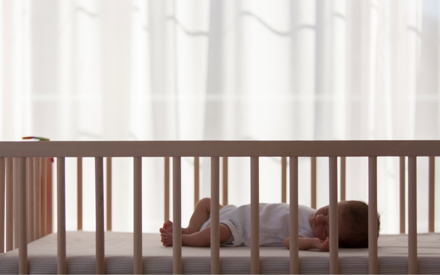 Newborn baby in a safe sleeping position.